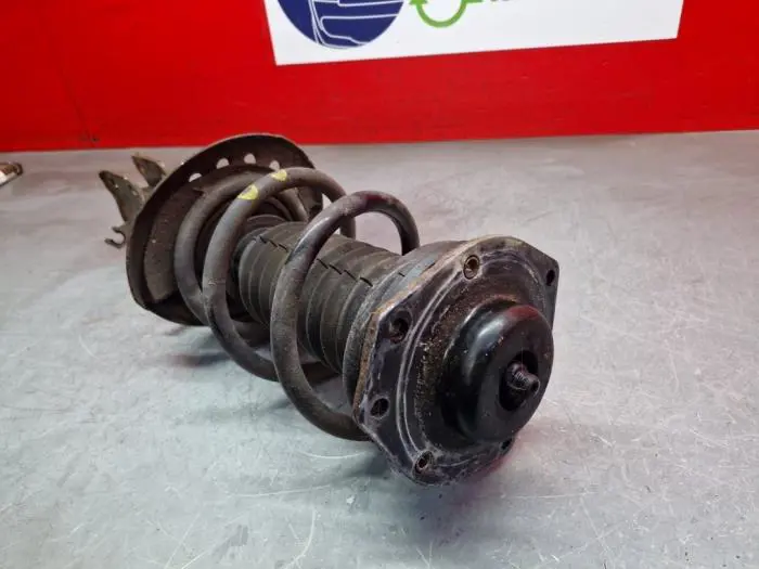 Fronts shock absorber, left Nissan NV200