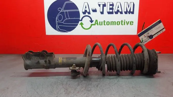 Fronts shock absorber, left Mazda 2.